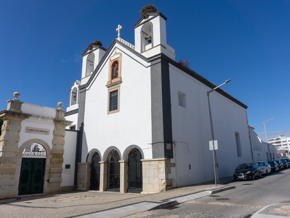 Stork nests on a church in Faro